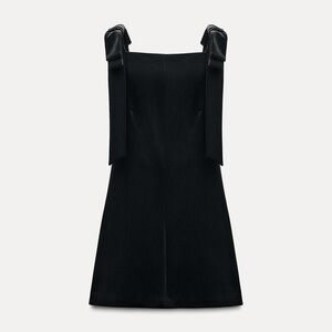 Velvet bow mini dress with straight neckline.
